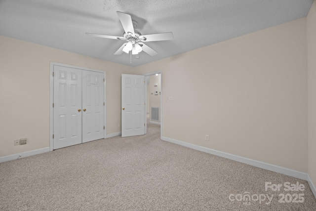 3039 Paraham Rd S, York, SC 29745 - unfurnished bedroom featuring carpet floors, baseboards, a textured ceiling, and a closet