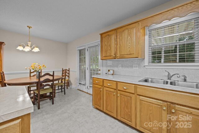 3039 Paraham Rd S, York, SC 29745 - kitchen featuring a sink, light countertops, a chandelier, and healthy amount of natural light
