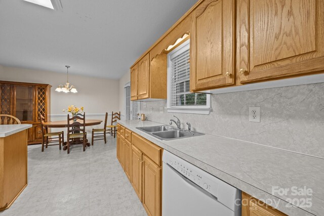 3039 Paraham Rd S, York, SC 29745 - kitchen featuring dishwasher, a sink, light countertops, decorative backsplash, and a chandelier