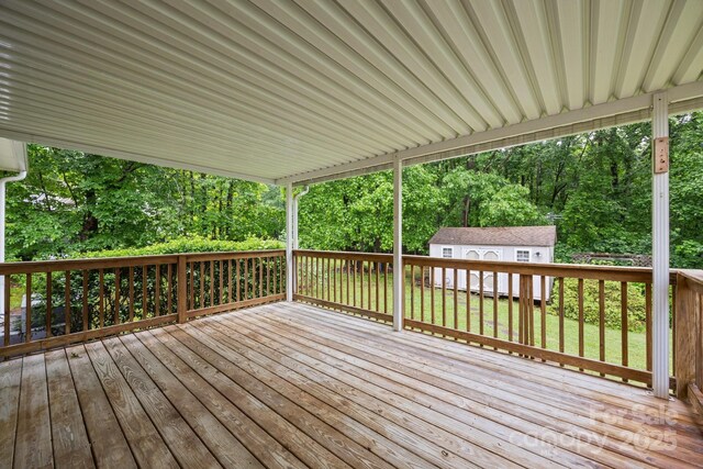 3039 Paraham Rd S, York, SC 29745 - wooden deck featuring an outbuilding, a lawn, and view of wooded area