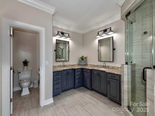 full bathroom with toilet, double vanity, ornamental molding, and a sink