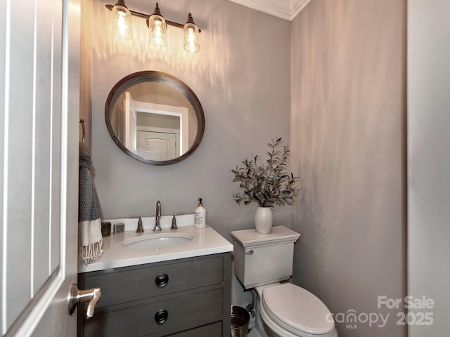 bathroom with toilet and vanity