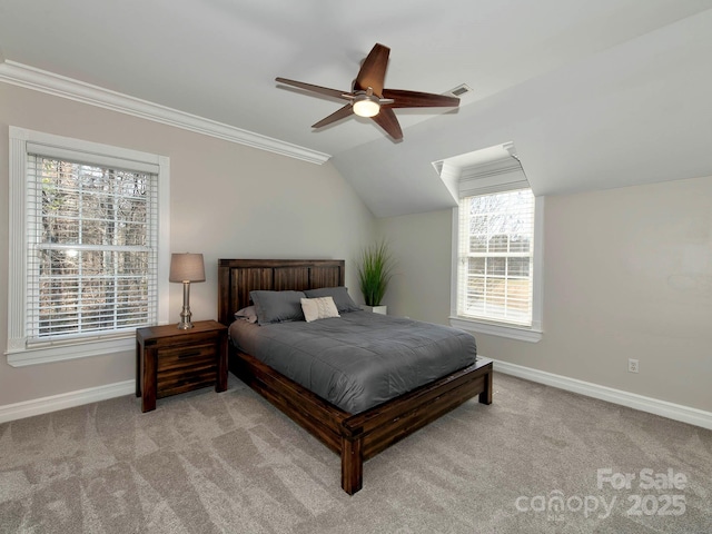 bedroom featuring vaulted ceiling, crown molding, visible vents, and light colored carpet