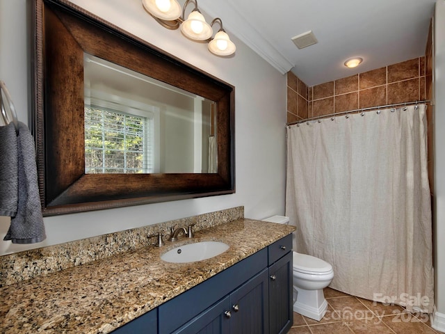 bathroom featuring visible vents, toilet, a shower with curtain, tile patterned floors, and vanity