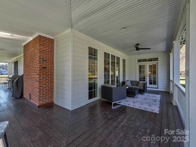 deck with ceiling fan, an outdoor living space, and grilling area