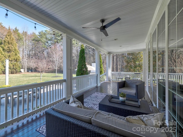 exterior space with ceiling fan