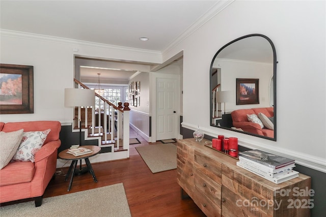 interior space with ornamental molding, stairway, wood finished floors, and a notable chandelier