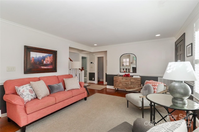 living room featuring stairs, ornamental molding, wood finished floors, and recessed lighting