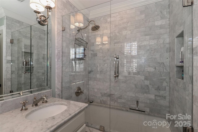 bathroom with ornamental molding and vanity