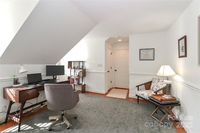 home office with vaulted ceiling, wood finished floors, and baseboards