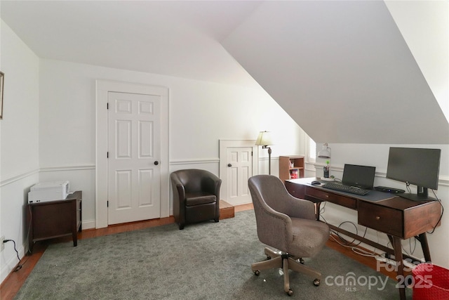 office with vaulted ceiling and wood finished floors