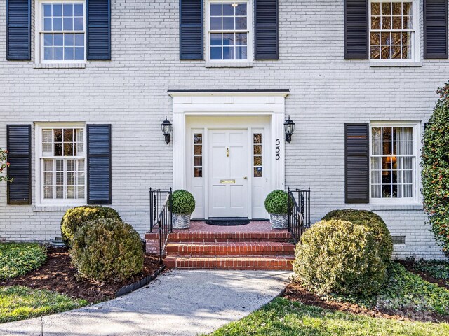 entrance to property with brick siding