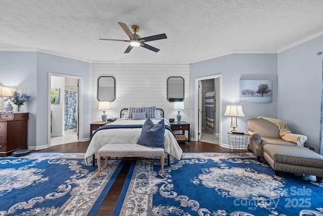 bedroom featuring crown molding, wood finished floors, and a textured ceiling