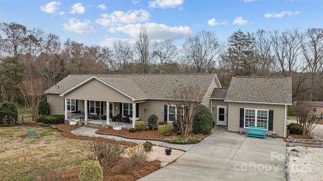 ranch-style home featuring a porch and a shingled roof