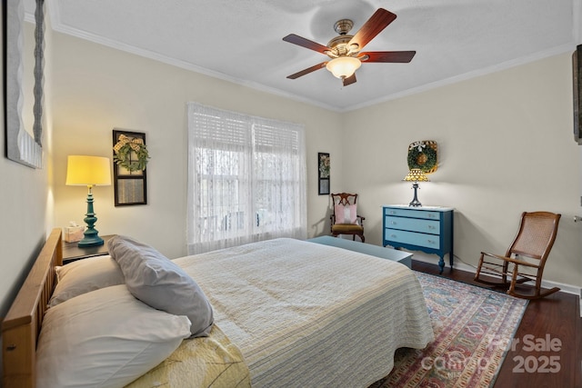 bedroom featuring baseboards, a ceiling fan, wood finished floors, and crown molding