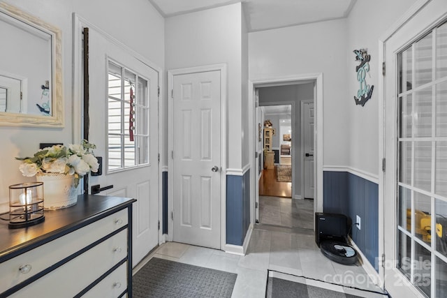 entryway with light tile patterned floors