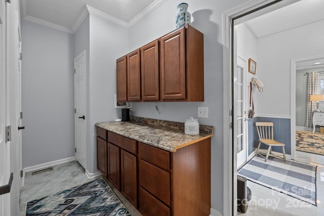 kitchen with baseboards and ornamental molding