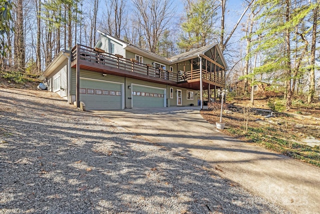 view of side of home with driveway