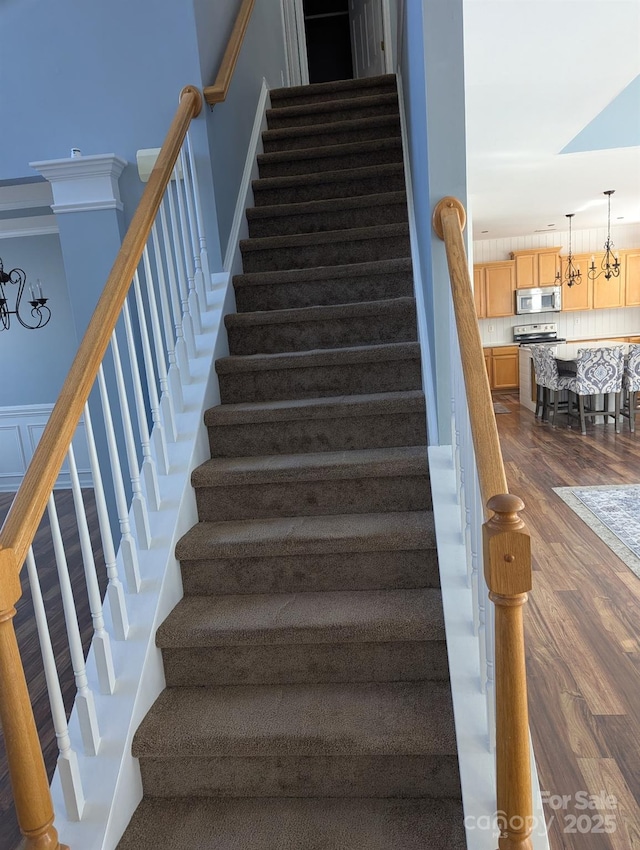 stairway with wood finished floors