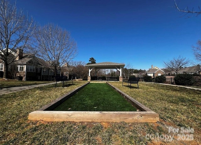 view of property's community featuring a gazebo and a lawn