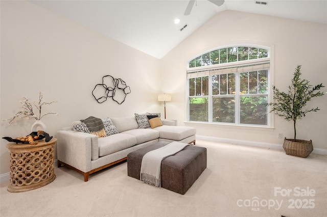 living area featuring carpet floors, baseboards, visible vents, a ceiling fan, and lofted ceiling