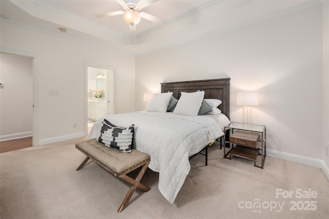 bedroom with ornamental molding, a raised ceiling, light carpet, and baseboards