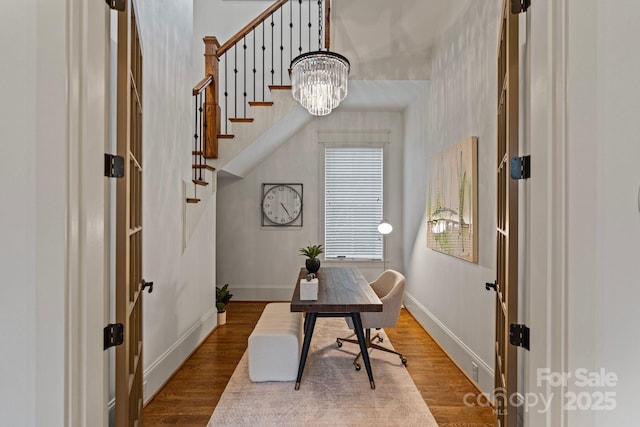 office space with wood finished floors and baseboards