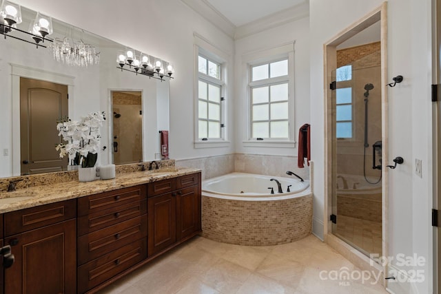 bathroom with a sink, a stall shower, a bath, and double vanity