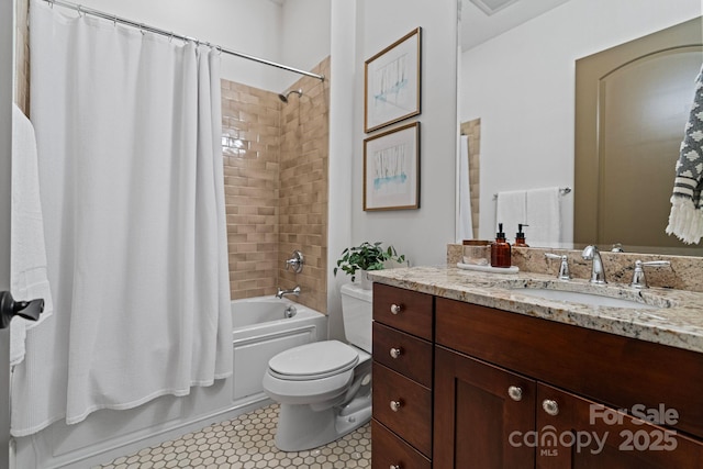 bathroom featuring tile patterned floors, toilet, shower / bath combo, and vanity