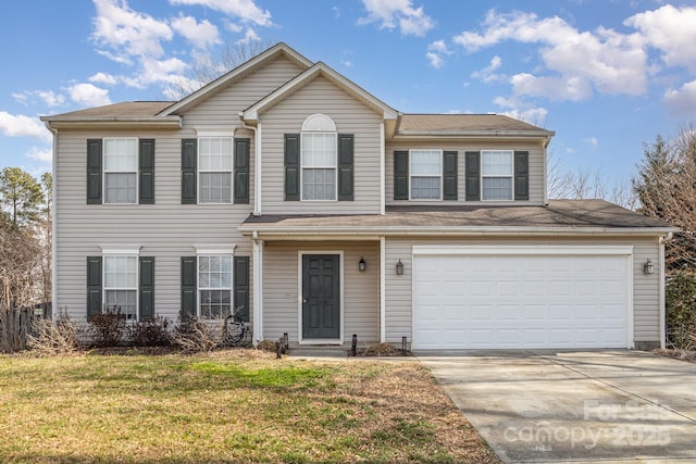 view of front of home featuring a garage, concrete driveway, and a front lawn