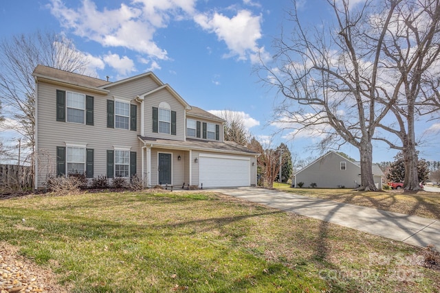 view of front of house with concrete driveway, a front lawn, and an attached garage