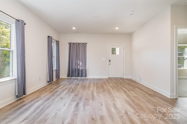 interior space featuring light wood finished floors, baseboards, and recessed lighting