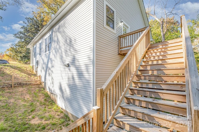 view of property exterior featuring stairway