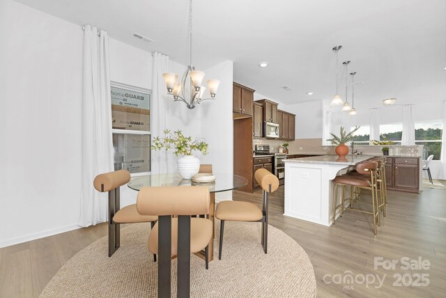 25966 Appleyard Ct Unit 1205, Lancaster, SC 29720 - dining room featuring light wood-style floors, a chandelier, and recessed lighting