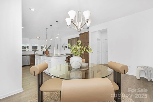 25966 Appleyard Ct Unit 1205, Lancaster, SC 29720 - dining space featuring light wood-style floors and a chandelier