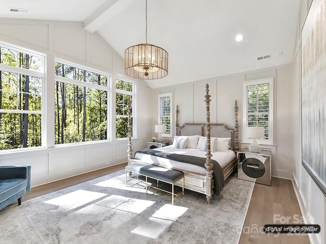 19419 Youngblood Rd W Unit 2, Charlotte, NC 28278 - bedroom featuring visible vents, a decorative wall, and lofted ceiling with beams