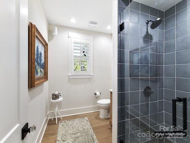 19419 Youngblood Rd W Unit 2, Charlotte, NC 28278 - full bath with toilet, baseboards, wood finished floors, and a tile shower