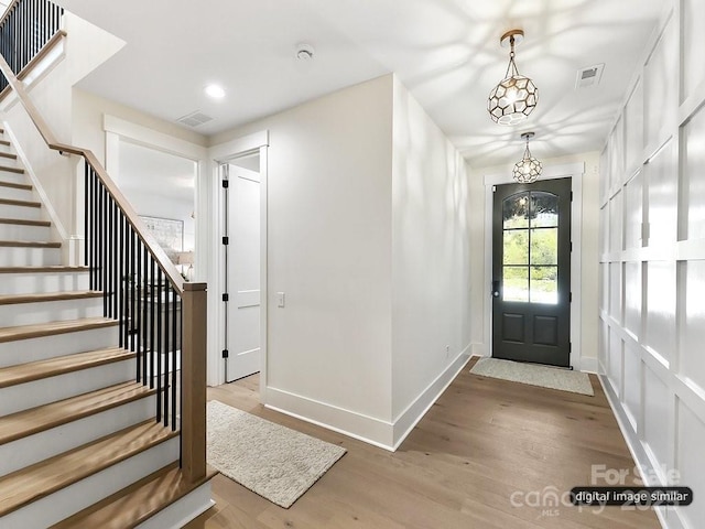 19419 Youngblood Rd W Unit 2, Charlotte, NC 28278 - foyer entrance with stairs, visible vents, and wood finished floors
