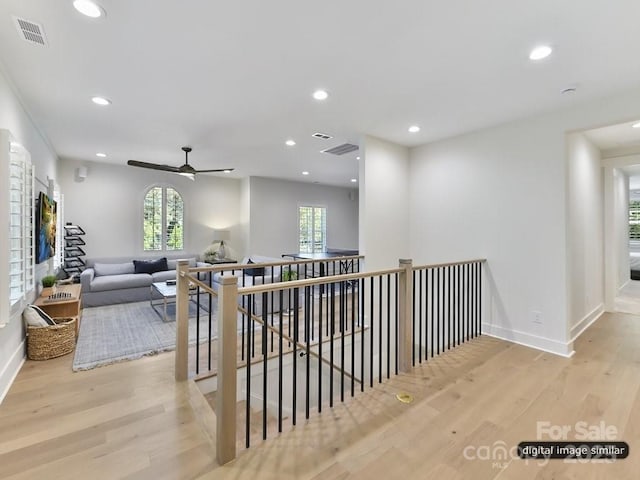 19419 Youngblood Rd W Unit 2, Charlotte, NC 28278 - hall with recessed lighting, an upstairs landing, visible vents, and wood finished floors