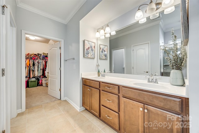 bathroom with ornamental molding, tile patterned floors, a sink, and double vanity