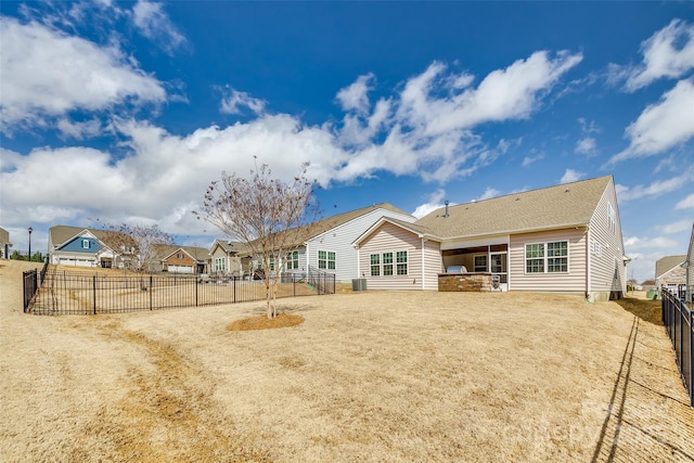 back of property featuring a residential view, a fenced backyard, and a patio