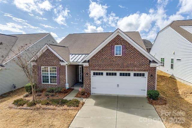 view of front of home featuring brick siding, driveway, and roof with shingles