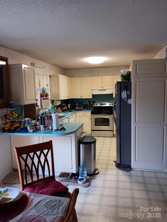 kitchen featuring appliances with stainless steel finishes, white cabinets, under cabinet range hood, and light floors