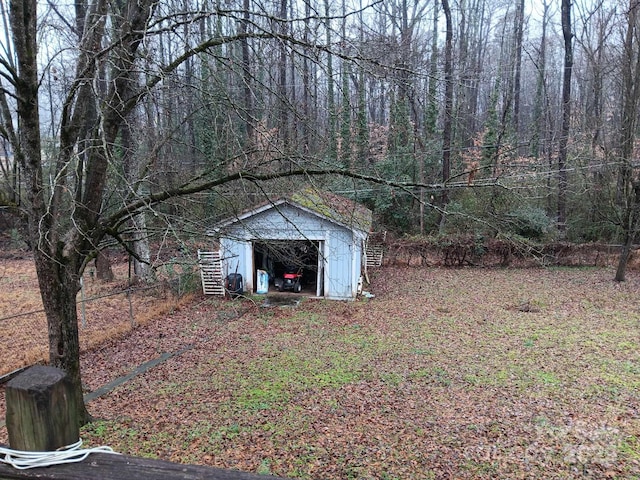 view of yard featuring an outbuilding and a shed