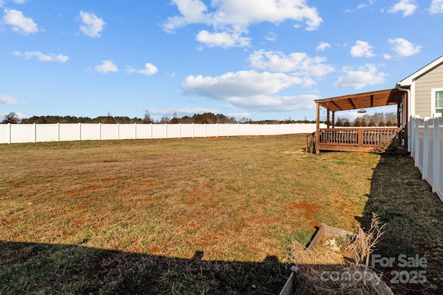 view of yard featuring a fenced backyard, a wooden deck, and a pergola