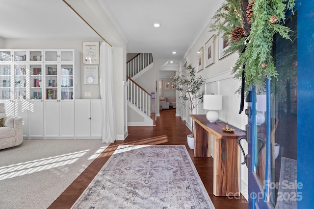 entrance foyer with stairs, dark wood-style flooring, and recessed lighting