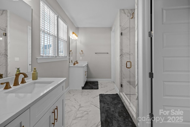 full bathroom featuring marble finish floor, two vanities, a sink, and a marble finish shower