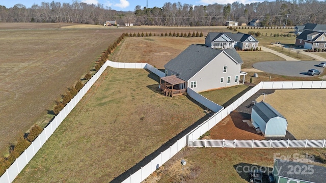 birds eye view of property featuring a rural view