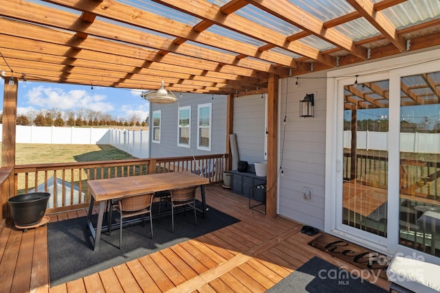 deck with fence, a pergola, and outdoor dining space