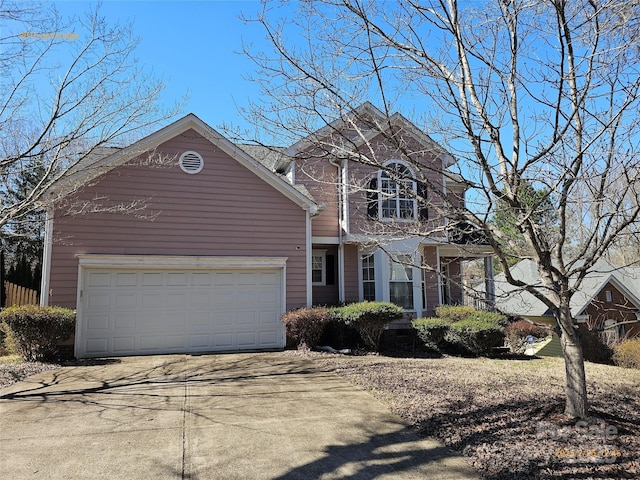 view of front facade with a garage and concrete driveway